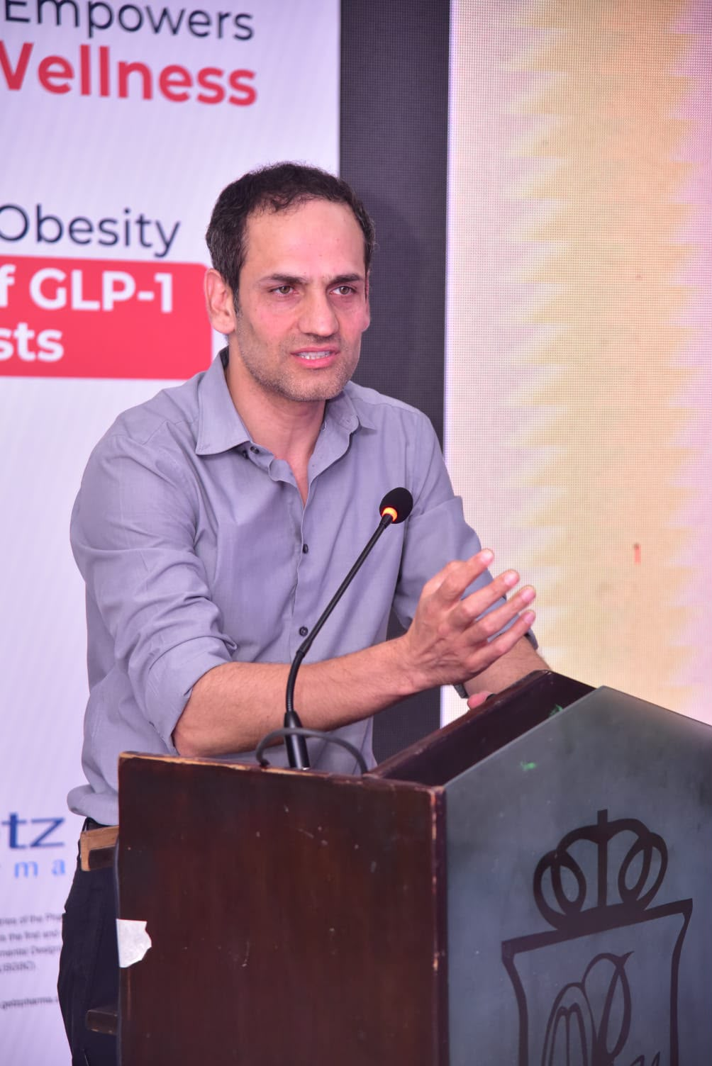 Dr Khan speaking about metabolic health at a medical event